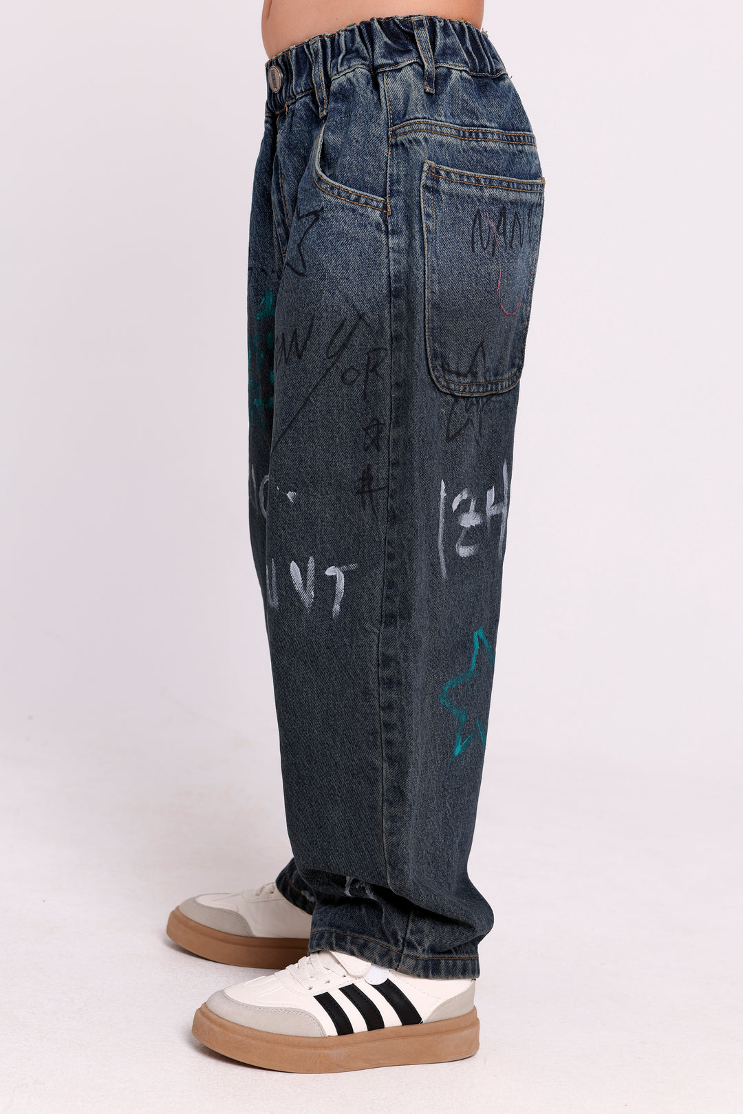 GRAFFITI PRINT DENIM PANTS