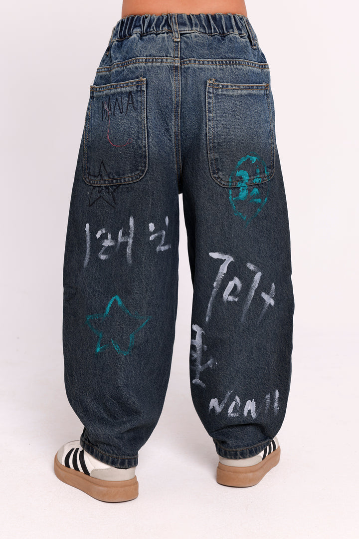GRAFFITI PRINT DENIM PANTS