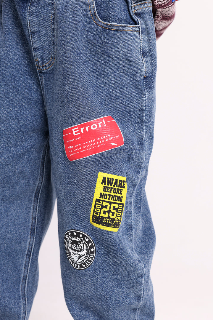 JEANS WITH ERROR PATCHES